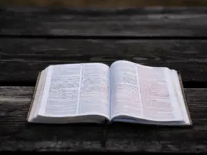 Bible Open on Wooden Table