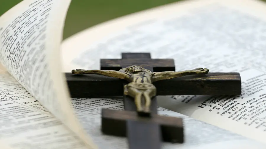 Open Bible With Cross Of Jesus Crucified