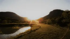 Light In Mountain Field With Water