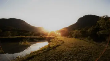 Light In Mountain Field With Water