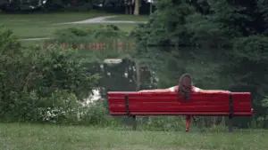 Resting Woman On Red Bench Near Pond 356x200