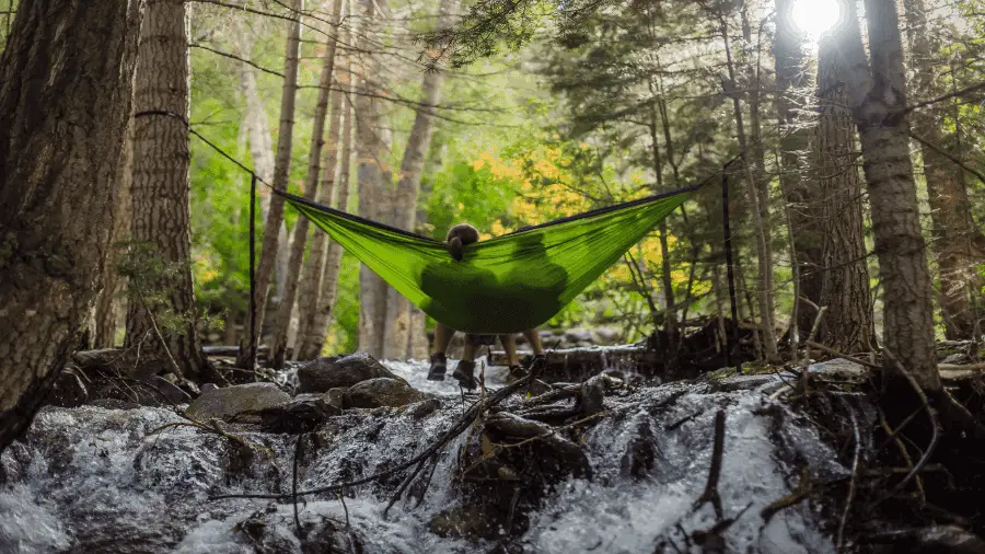 People Resting In Hammock Over Springs 900x506