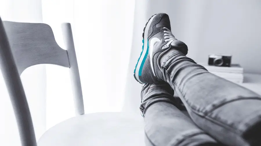 Person Resting With Legs On Chair 900x506