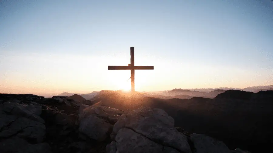 Cross On Rock With Sunlight 900x506